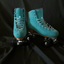 Load image into Gallery viewer, The Seed Project roller skates. Colour is Tui with turquoise laces on a black backdrop.