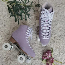 Load image into Gallery viewer, The Seed Project roller skates. colour is Tekapo with white laces surrounded by purple flowers and leaves.