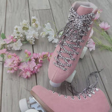Load image into Gallery viewer, The Seed Project roller skates. colour is Galah with black and white leopard laces on a wooden background surrounded wuth pinka nd white flowers.