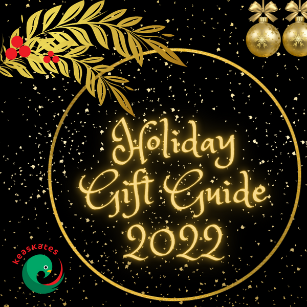 Black background with festive gold details and gold text reading "Holiday Gift Guide 2022"