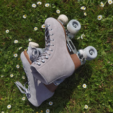 Load image into Gallery viewer, The Seed Project SeedPro roller skates. colour is Alpines with grey laces on a grassy background with daisy flowers
